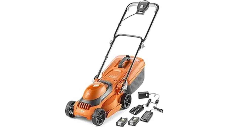 Cordless battery lawn mower cutting a UK garden lawn